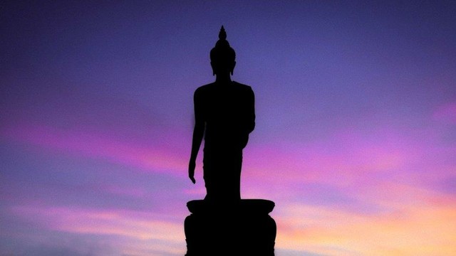 Standing Buddha statue.