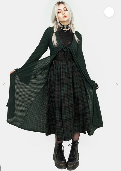 A screenshot from Disturbia's website of a woman wearing a thigh -length cardigan with long sleeves and a simple tie closure at the front.