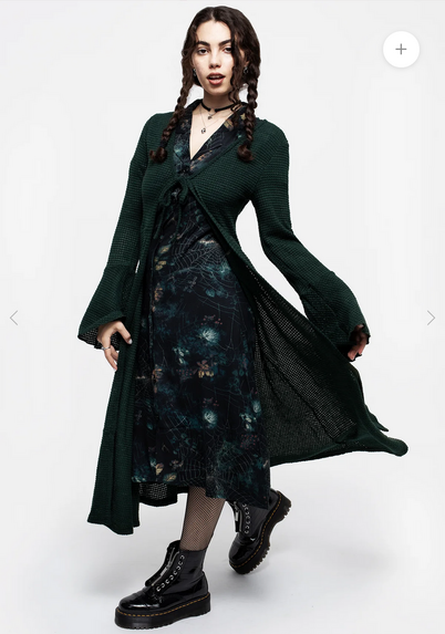 A screenshot from Disturbia's website of a woman wearing a thigh -length cardigan with long sleeves and a simple tie closure at the front.