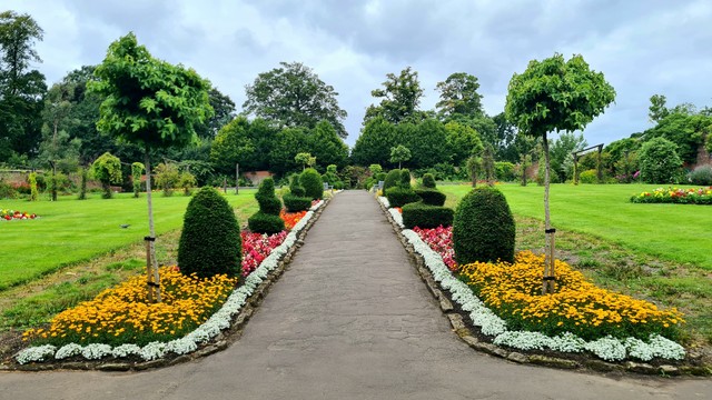 A walled garden, planted with flowers, in a Glasgow Park.