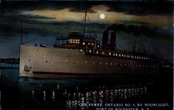 You see an old style steamship with two stacks sailing through the water. In the sky the moon breaks through partly clouded dark skies very good the lights of the steamer light up the surrounding water The boat is moving from right to left. At the bottom there is some text. The text states "car ferry, Ontario number 1, by Moonlight. Port of Rochester NY. "