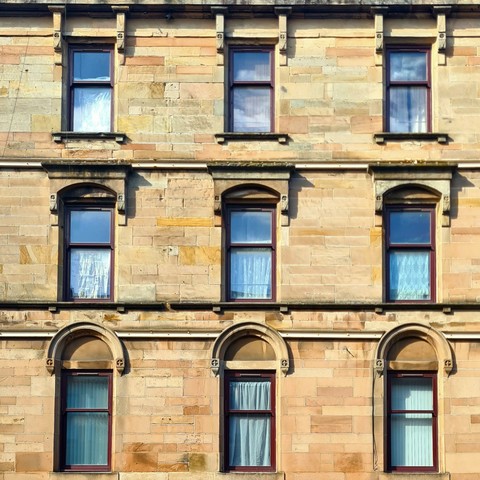 Windows on a late 19th century Glasgow tenement.
