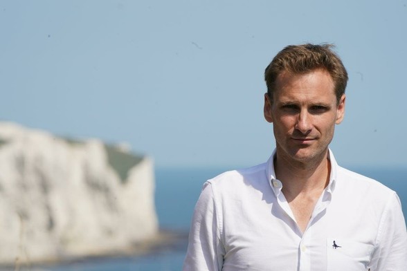 Chris Philp pelted with bottles and has knife pulled on him during trip to French migrant camp