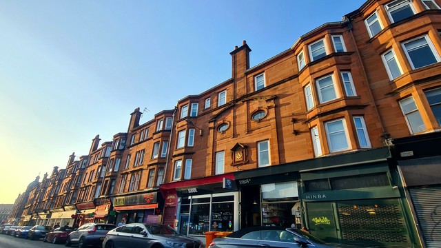 A red sandstone Glasgow tenement designed to look like a face.