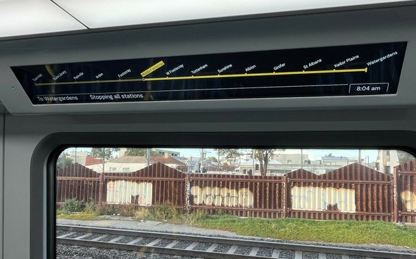Screen inside train showing stations from Town Hall to Watergardens