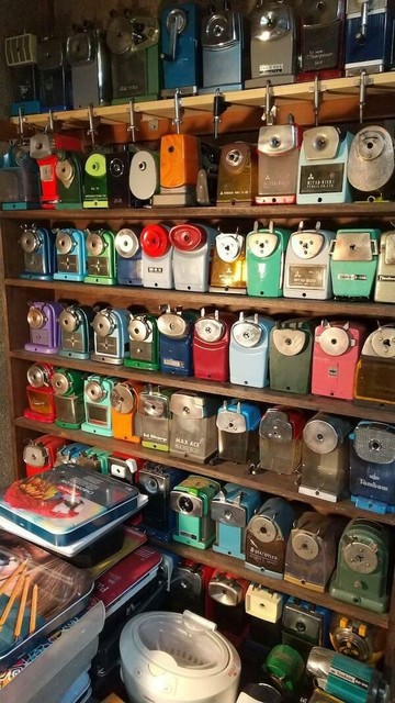 A bookshelf filled with vintage pencil sharpeners and the smell of graphite and wax, writing tools from a more civilized age.