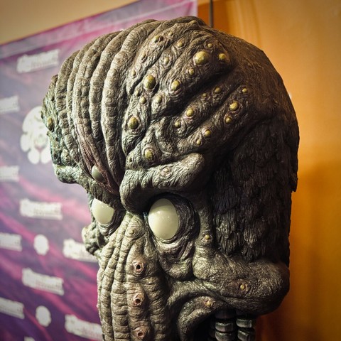 A large bust of Cthulhu stands in the lobby of Hollywood Theatre against a photoshoot backdrop.
