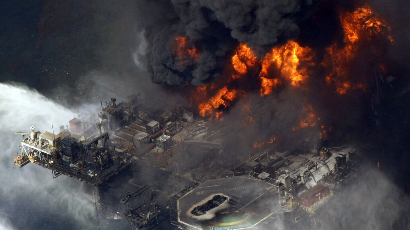 A plume of smoke rises from fires on BP's Deepwater Horizon offshore oil rig in the Gulf of Mexico on April 21, 2010. (AP Photo/Gerald Herbert, File)
