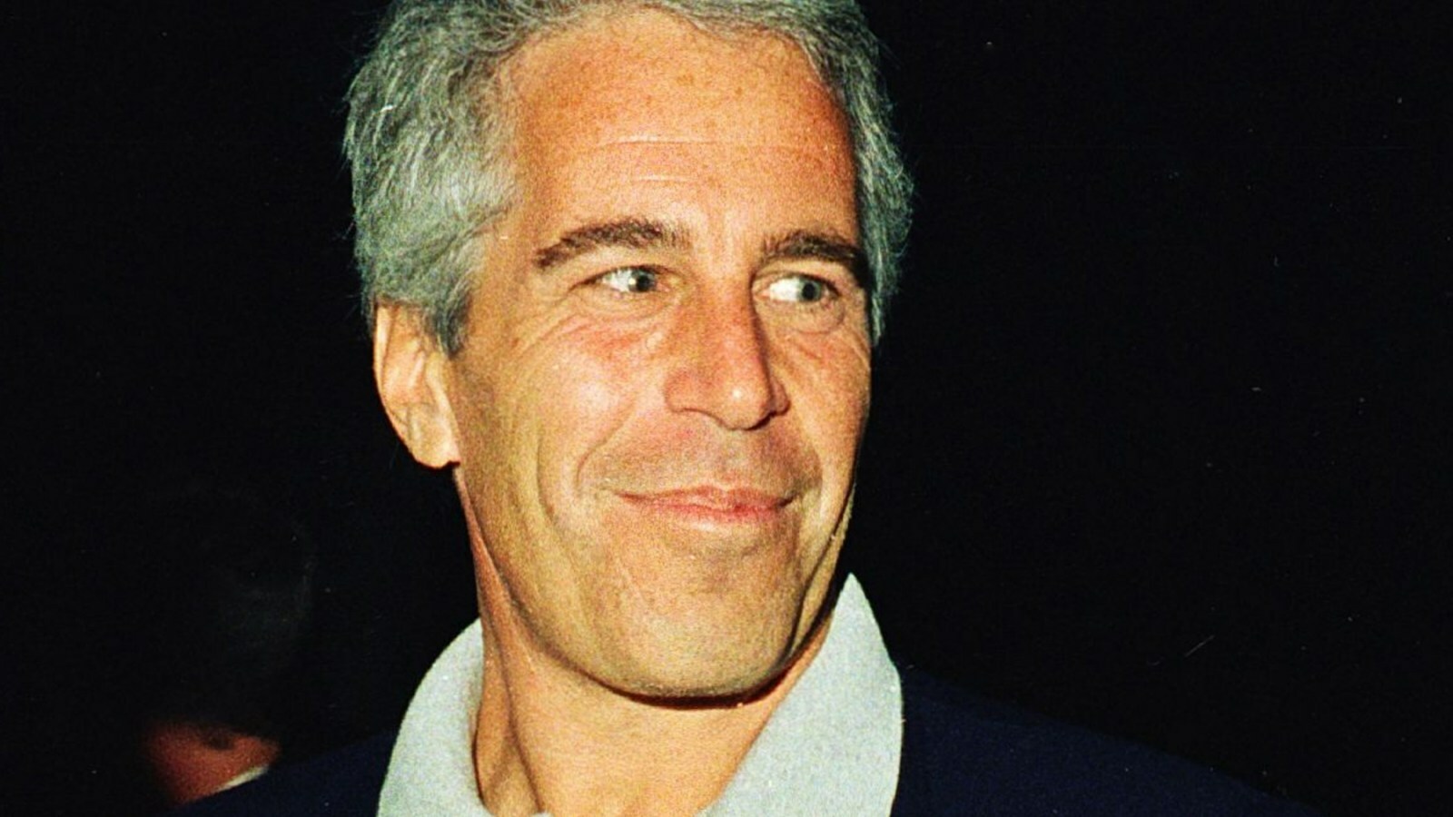 (L-R) Ghislaine Maxwell, Jeffrey Epstein, and musician Michael Bolton pose for a portrait during a party at the Mar-a-Lago club, Palm Beach, Florida, February 12, 2000. (Photo by Davidoff Studios/Getty Images) (L-R) Ghislaine Maxwell, Jeffrey Epstein, and musician Michael Bolton pose for a portrait during a party at the Mar-a-Lago club, Palm Beach, Florida, February 12, 2000. (Photo by Davidoff Studios/Getty Images)