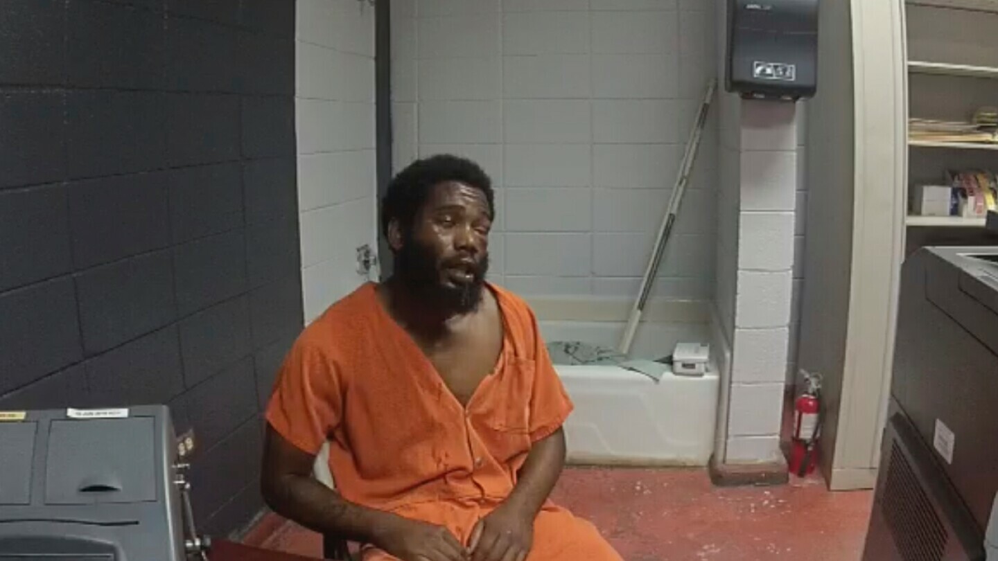 In this image from body camera video from the DeSoto Parish Sheriff's Office, Jarius Brown is interviewed following a jailhouse beating that left him with a bruised face, fractured eye socket and broken nose at the DeSoto Parish Detention Center in Mansfield, La., on Sept. 27, 2019. (DeSoto Parish Sheriff's Office via AP)