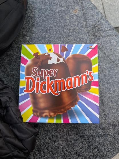 Box of some kind of chocolate covered marshmallow snack branded "super dickmann's"
