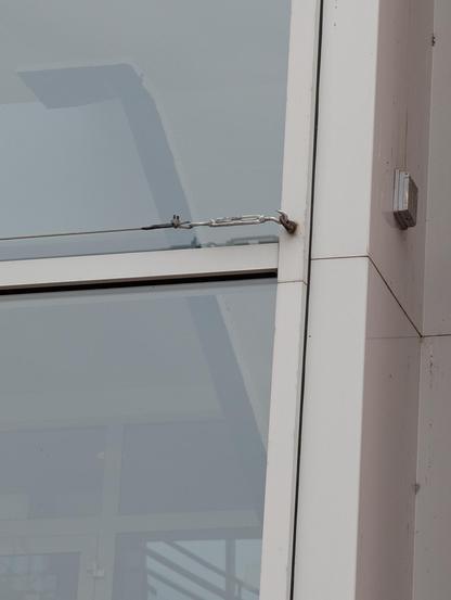 Closeup of one of the steel cables mounted to the eyes