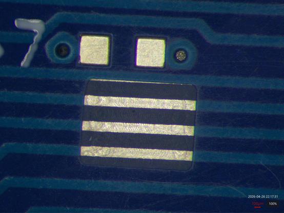 Small cutout milled into soldermask exposing  three copper traces, now plated with silver