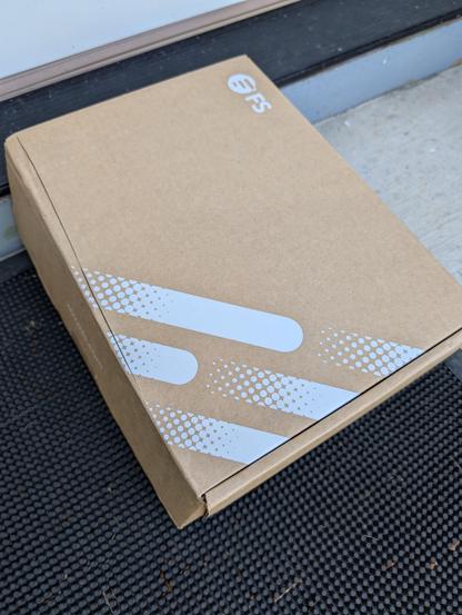 Cardboard box with FS logo on it
