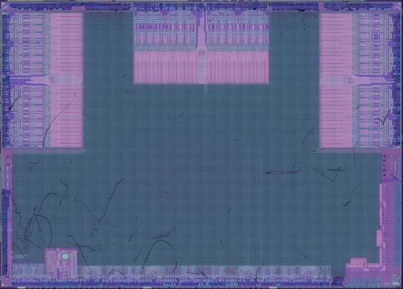 IC die image with obvious analog blocks along the north, east, and west side, some other IO on the south, and an L-shaped block in the southeast