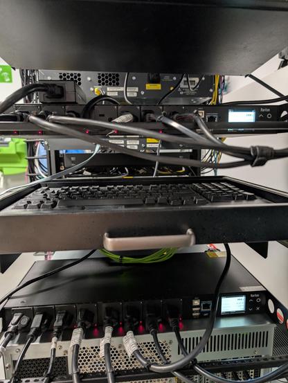 Back view of a server rack showing managed PDUs