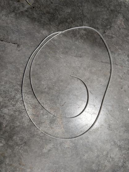 Large strip of empty 8mm paper tape on the floor