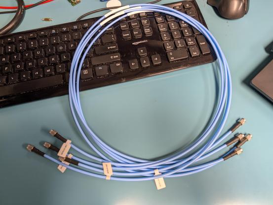 Four blue coaxial cables coiled up