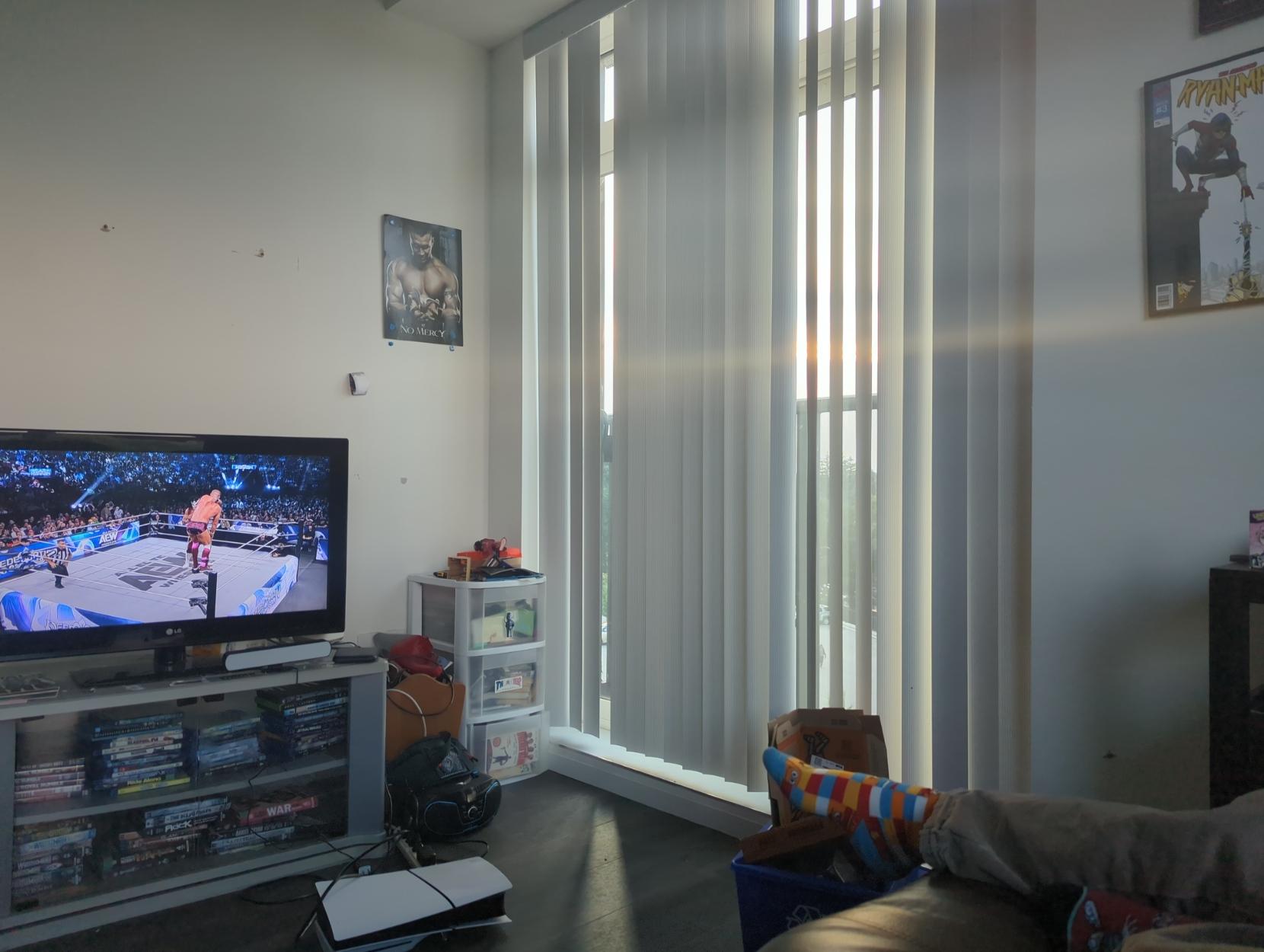 wRestlers on the top turnbuckle next to a sunny window