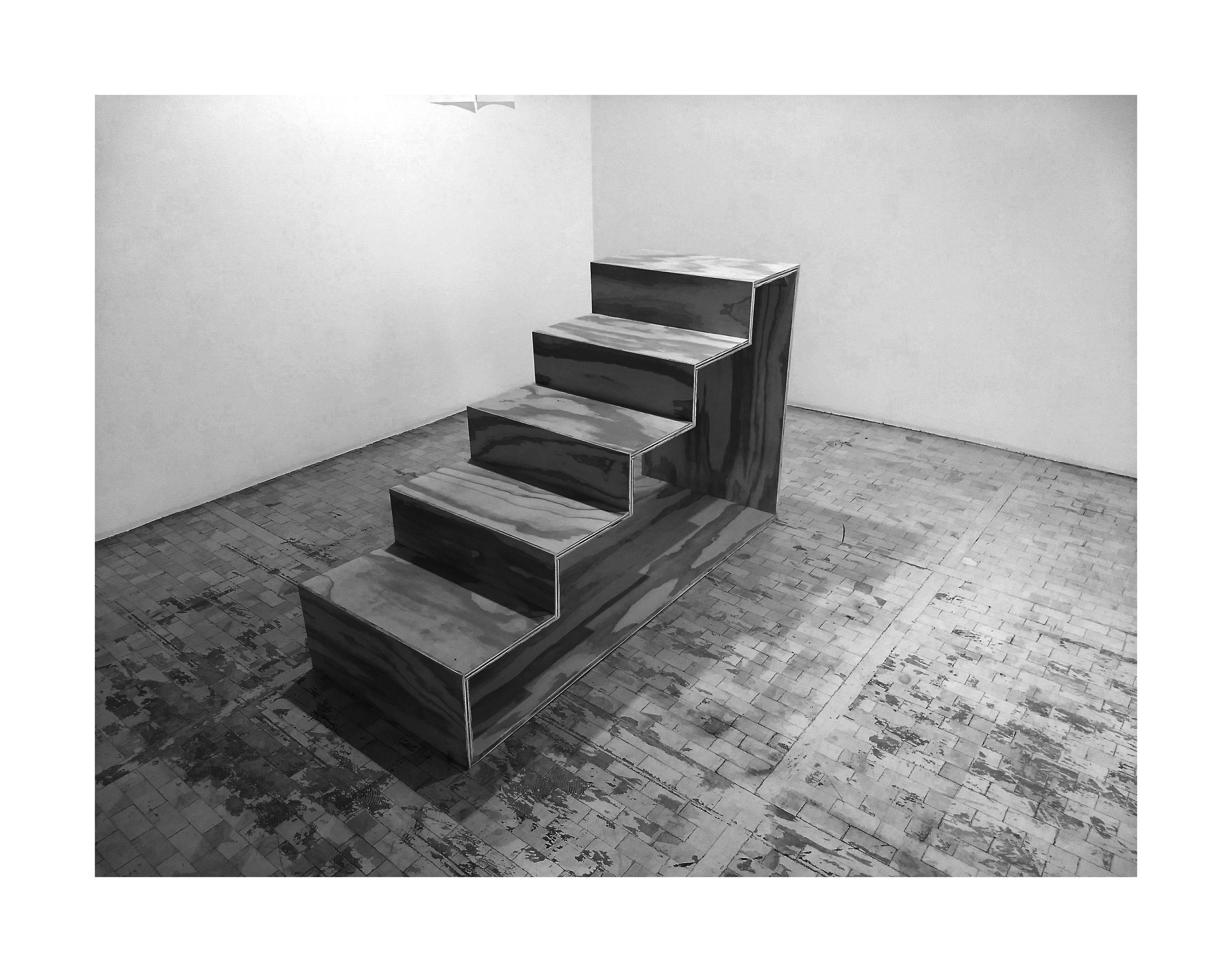 a photo of a small stair which is not fixed to any wall and any place, just to the floor.