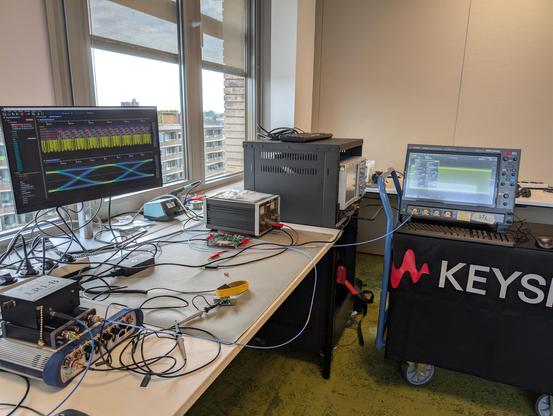 Ngscopeclient displaying waveforms from a Keysight MXR oscilloscope sitting on a cart with a Keysight banner