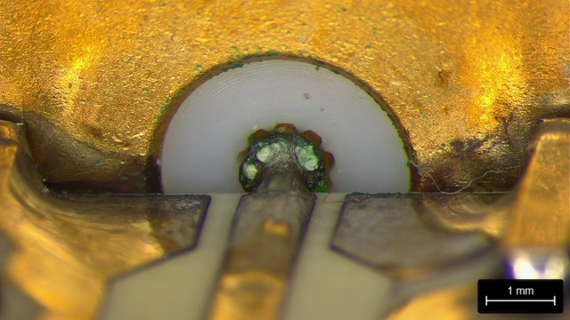 SMA connector with green and white corrosion on the center pin