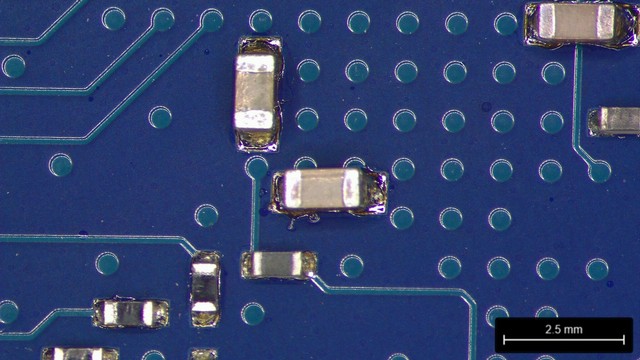 Several SMT passives on the underside of a PCB