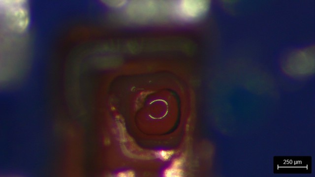 Back side of the target BGA pad coming into view through the dielectric