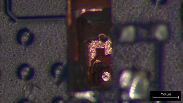 Angled view showing the 250um exposed copper dot I need to solder to, at the bottom of the deep hole