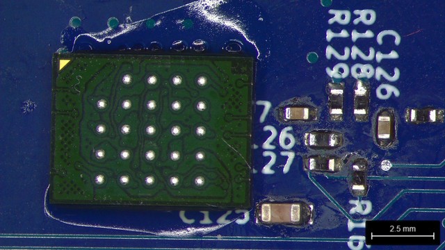24 ball BGA glued to a board upside down, next to a bunch of passives