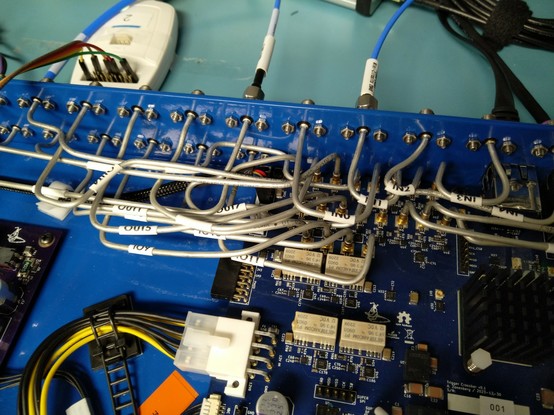 Closeup showing the tangled spaghetti of cables going into the I/O region of the board