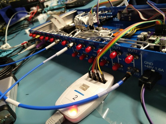 Back side view showing rear panel connectors with red dust caps on ones not connected to anything