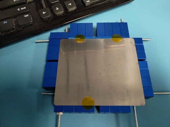 PCB under a stencil in a solder paste jig