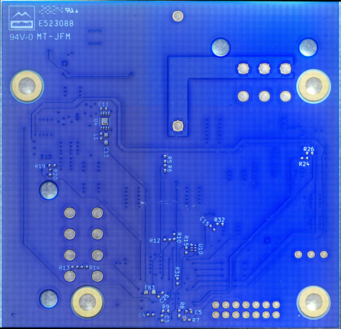 Bottom view of a blue PCB with gold plated pads, showing solder paste deposits on the pads but no components