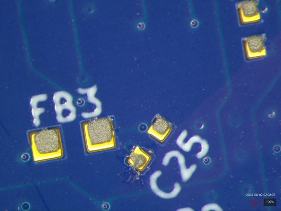 C25 area showing hand-applied solder paste with some loose solder spheres around it