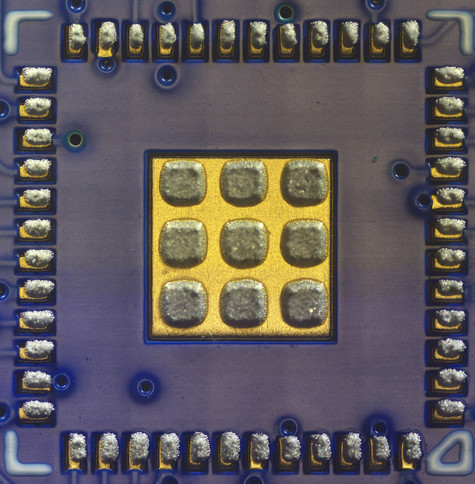 QFN-48 footprint showing detail of solder paste deposits on each pad and a 3x3 pattern of paste deposits on the center thermal pad