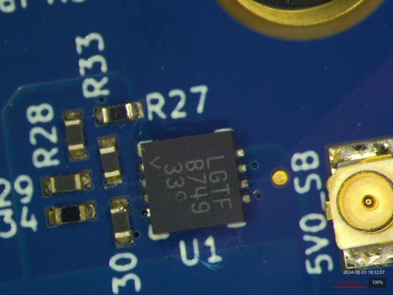 8 pin DFN on a PCB next to a couple of passives