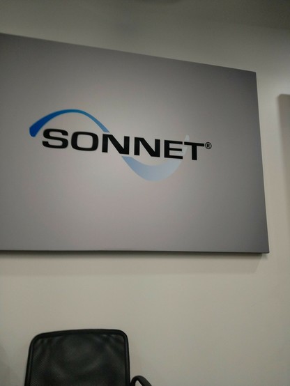 Sonnet Software logo on the wall of a conference room