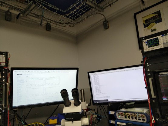 Corner above two computer monitors with cable tray above