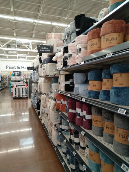 Shelf in a Walmart labeled "bedding coordinates"