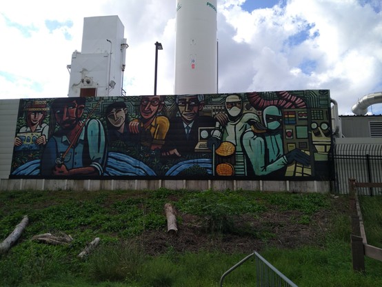 Mural on the wall of the fab depicting local residents and foundry workers