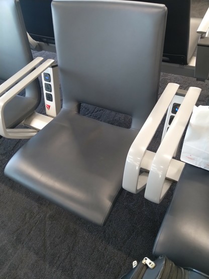 Airport waiting area chair with a hole where the seat back and bottom meet. Perfectly placed for a tail to hang through instead of being uncomfortably sat on, as long as said tail isn't too bushy