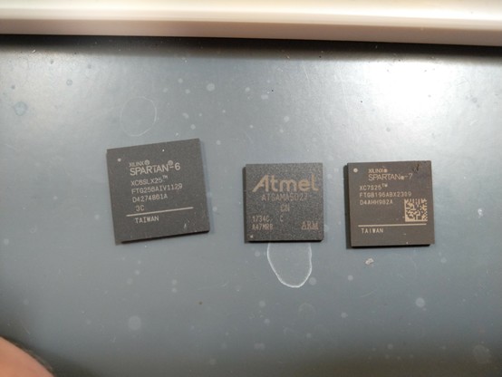 Several BGA packaged chips on a lab bench