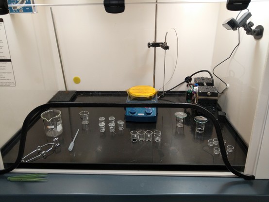 Glassware in a fume hood being prepped for an experiment