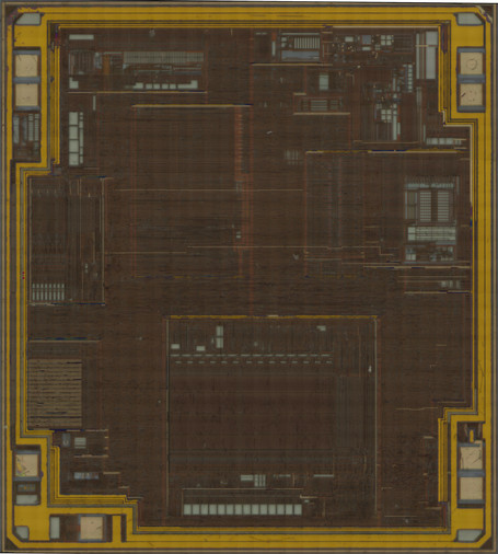 PIC12F683 at top metal with passivation mostly etched off, but still remaining in traces on some metal tracks as well as almost the entire power/ground rings around the periphery