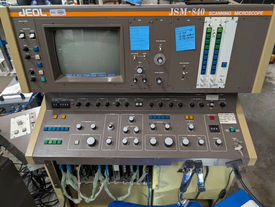 Front panel of a JEOL JSM-840 scanning electron microscope.

It's probably as old as me, with a CRT display and lots of analog dials and 7 segment displays.