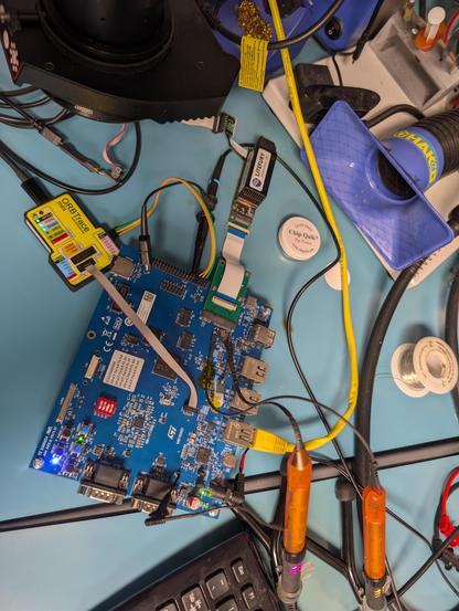 LiteFury M.2 FPGA dev board attached to an STM32MP2 dev board by a ribbon cable
