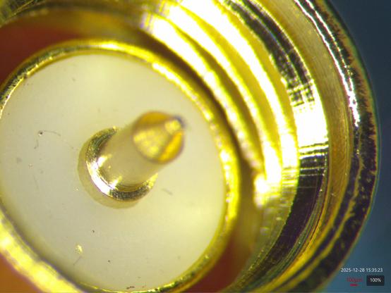 Male SMA connector with the shoulder of the center pin protruding massively past the dielectric, likely destroying anything it's mated to