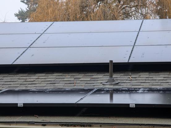 Solar panels covering most of a roof